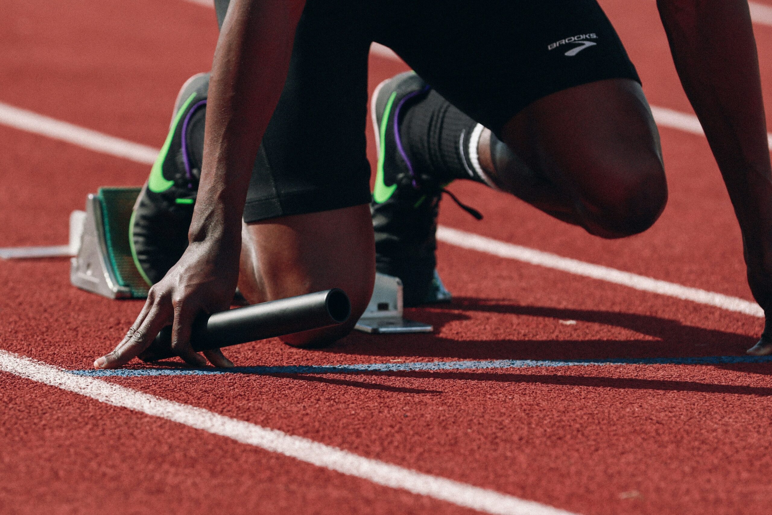 Athlete runner, preparing on the start line.