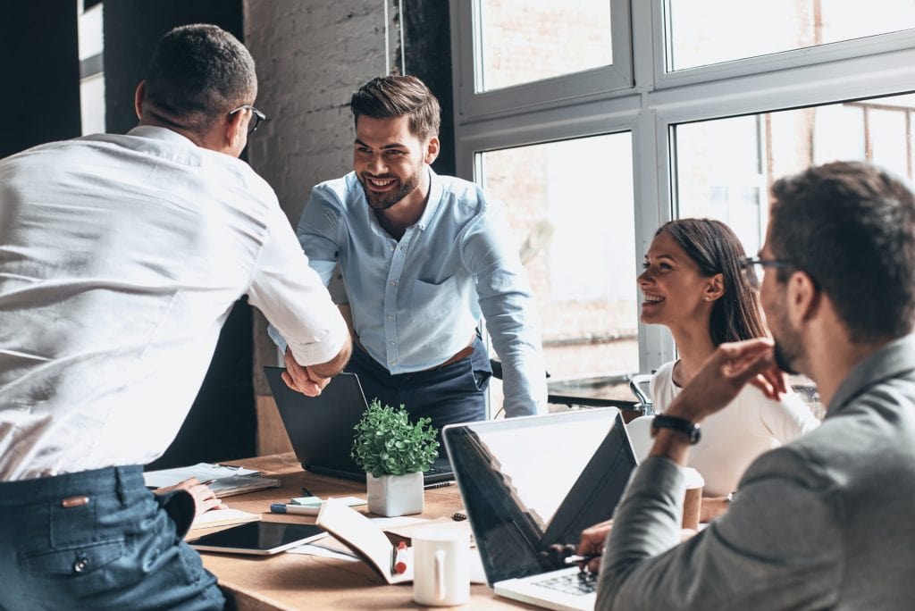 A group of people in a meeting room