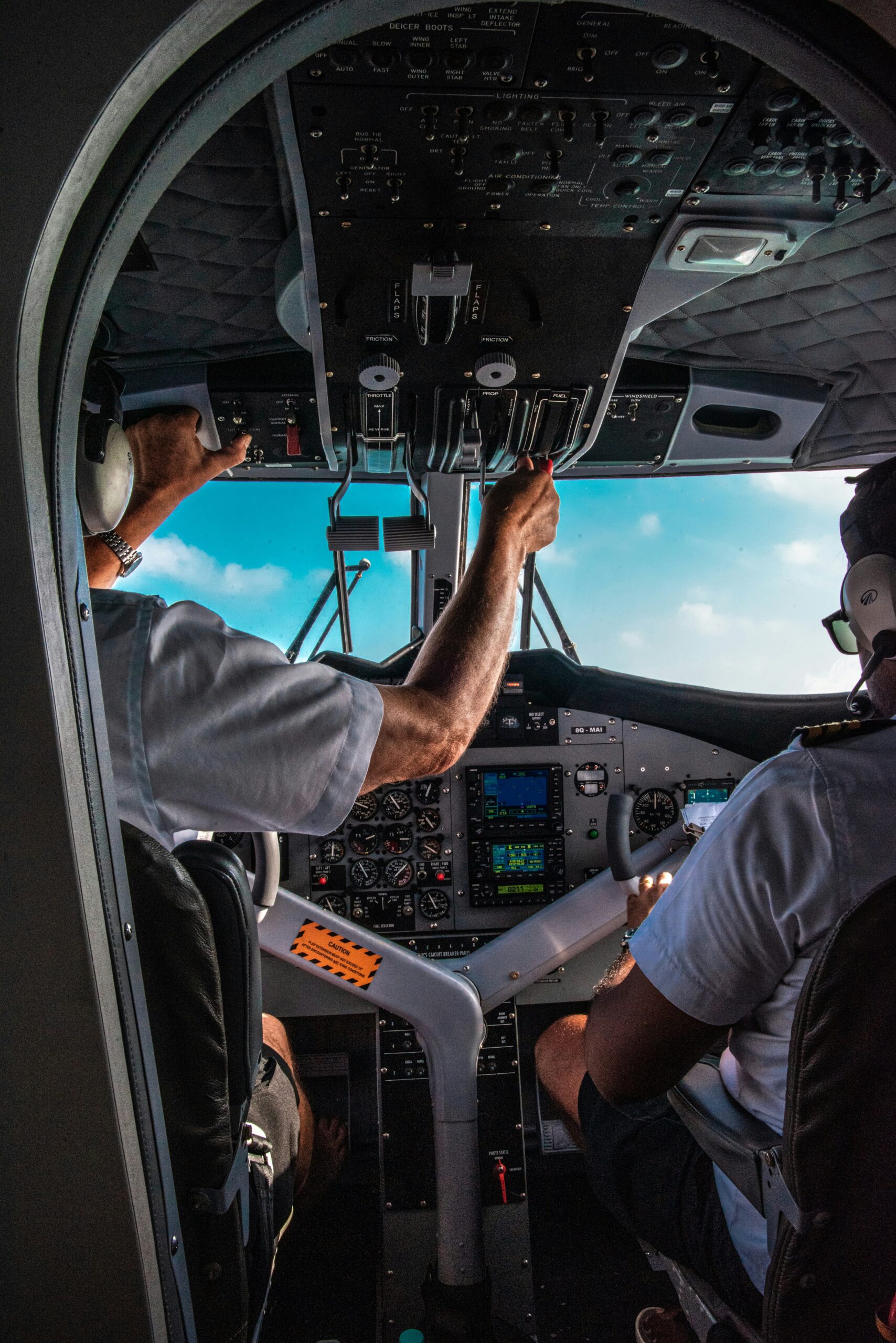 Two pilots preparing a plane for takeoff.